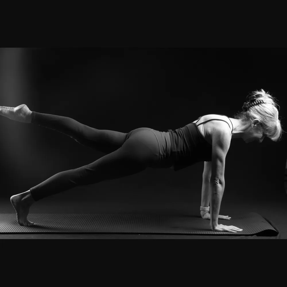 Florence in a plank with one leg lifted
